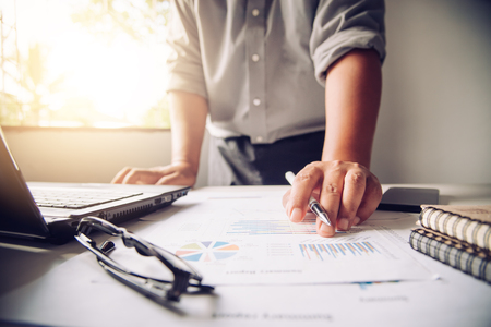 Business people are working on accounts in business analysis with graphs and documentation.の写真素材