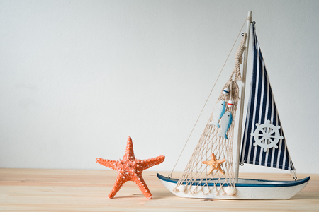 Replica shells, yacht simulators, resting on a wooden tripod concept.の写真素材