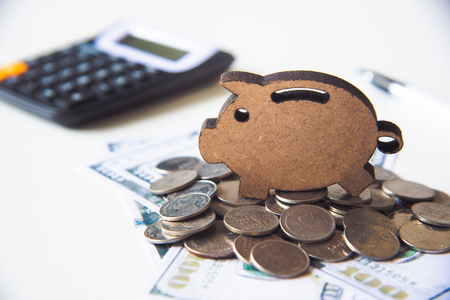 icon piggy save placed on pile of money -concept save moneyの写真素材