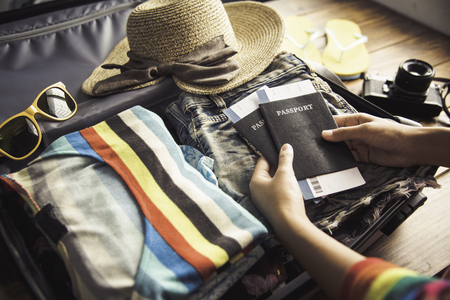 People holding passports, map for travel with luggage for the trip