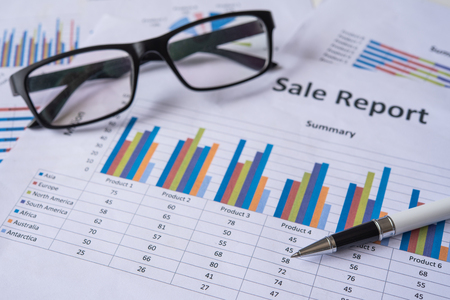 Top view with document pen graph and accounting documents placed on the desk in officeの写真素材