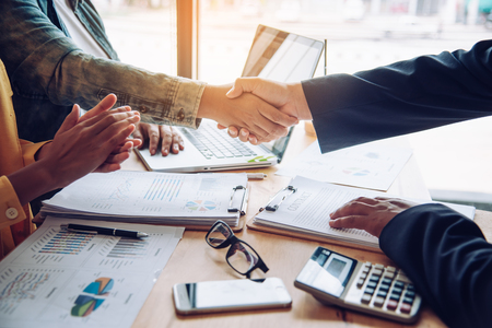 Handshake between joint venture businessmen after good management and have good conceptの写真素材