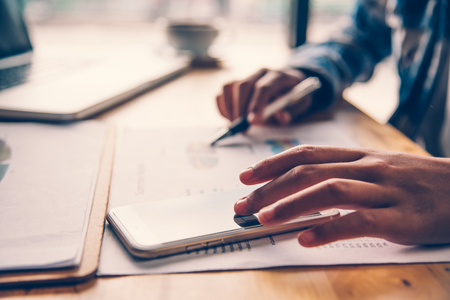 Business people are working on smartphone technology to communicate. Research Purchasing Onlineの写真素材