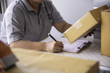 Shipping staff are checking the product before shipping to the customer.の写真素材