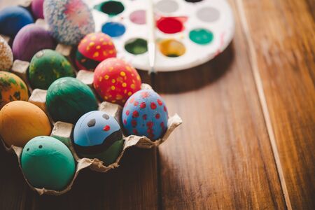 Easter eggs on wooden backgroundの写真素材