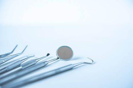  close up dentist  tools for teeth care at white background top view の写真素材