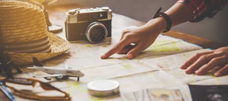 Travelers are planning a trip by searching the route on the map and searching for information on the...