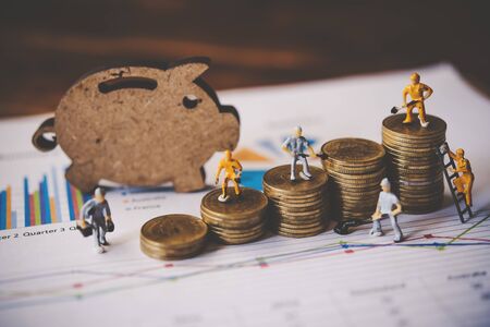 Miniature people or small figure worker on coin arranged. Business Financial Planning Financial Analysis for Corporate Growth concept.の写真素材