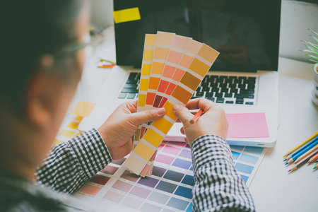 The graphic designer creative team is currently working on the design and color selection on the guide color for advertising design.の写真素材