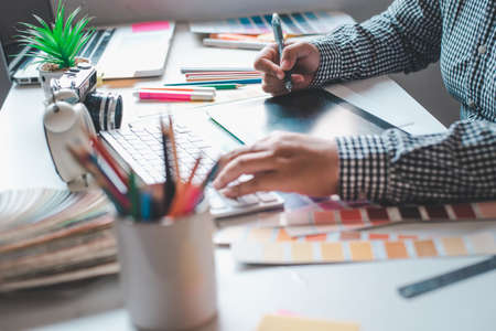 The graphic designer creative team is currently working on the design and color selection on the guide color for advertising design.の写真素材