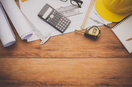 Top view with laptop, mobile phone, coffee cup, pencil, pencil and glasses placed on a black...
