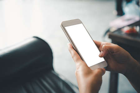 Asian business woman  hand using and touching smart phone with white blank empty screen.