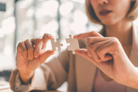 Business people are taking puzzles to connect. Ideas about building a business network.