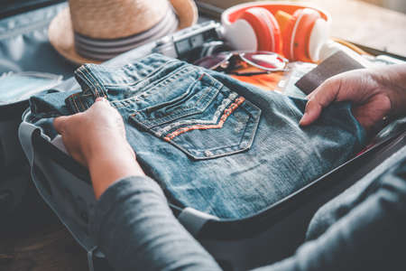 Tourists are packing luggage for travel.concept tourism planning and new normal travelの写真素材