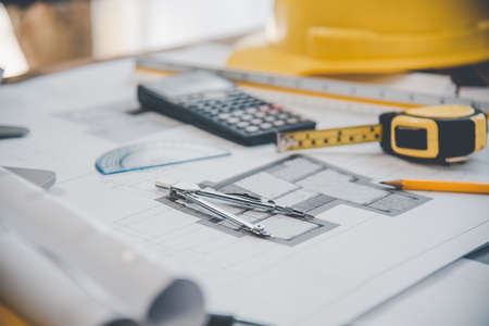 dividers are placed on the work desk, with house plans designed. Including engineering equipment