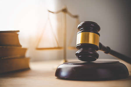 Law theme, mallet of the judge, law enforcement officers, evidence-based cases and documents taken...