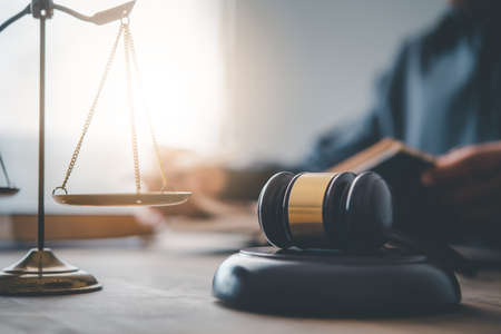 Law theme, mallet of the judge, law enforcement officers, evidence-based cases and documents taken into account.の写真素材