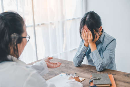 Patients suffering from depression come to consult a psychiatrist for advice and treatment guidelines.の写真素材