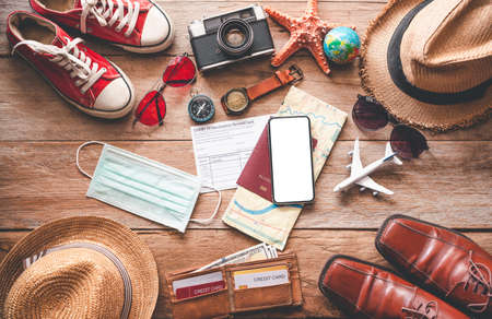 Protection while Traveling. Travel accessories costumes. Passports, luggage, The cost of travel maps prepared for the trip .concept new normal lifestyleの写真素材