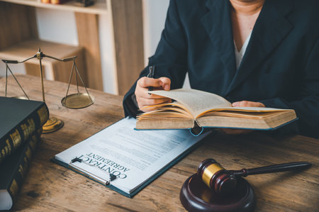 Lawyers reading the law Law theme, mallet of the judge, law enforcement officers, evidence-based cases and documents taken into account.の写真素材