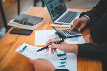 group of business people working and communicating together in the office With the charging of graphs for analysis, conceptual analysis and business planningの写真素材