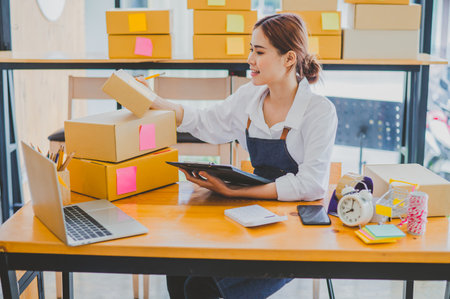 Small business owners online are checking their orders. where customers place orders and check the...