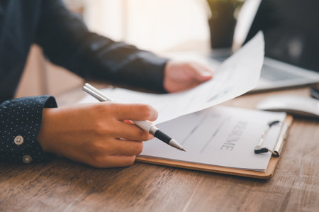 Individuals or recent grads looking for work and filling out a job application should first evaluate the application before applying for a position.の写真素材