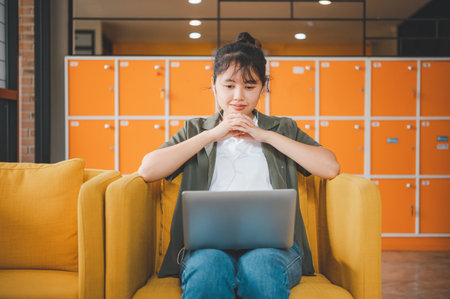 Teenage Asian  are communicating through video conferencing for online learning. In a video conference call via apps. new normal conceptの写真素材