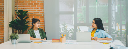 group of business people working and communicating together in the office With the charging of graphs for analysis, conceptual analysis and business planningの写真素材