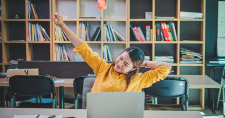 businesswoman is doing a relaxing pose to relieve fatigue after working for a long time.
