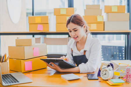 Small business owners online are checking their orders. where customers place orders and check the...