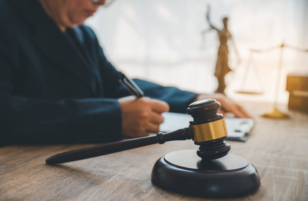 Law theme, mallet of the judge, law enforcement officers, evidence-based cases and documents taken into account.の写真素材