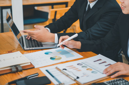 group of business people working and communicating together in the office With the charging of graphs for analysis, conceptual analysis and business planningの写真素材