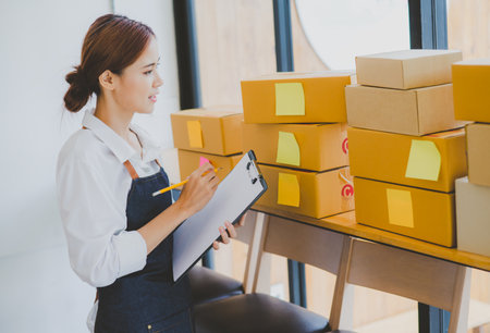 Small business owners online are checking their orders. where customers place orders and check the...
