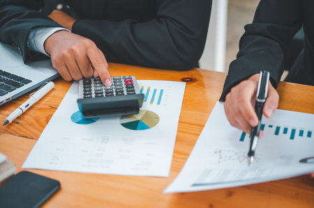 group of business people working and communicating together in the office With the charging of graphs for analysis, conceptual analysis and business planningの写真素材
