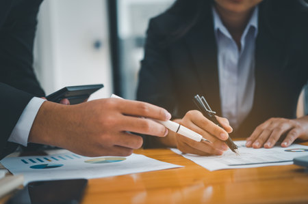 group of business people working and communicating together in the office With the charging of graphs for analysis, conceptual analysis and business planningの写真素材