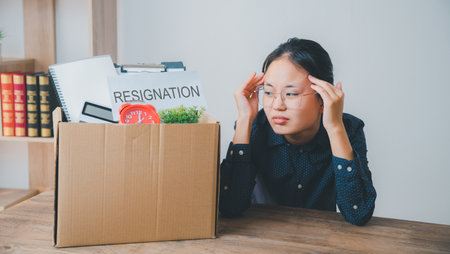 Female company employee stressed and fed up after quitting her job to look for a new job, fired or was fired by the employerの写真素材