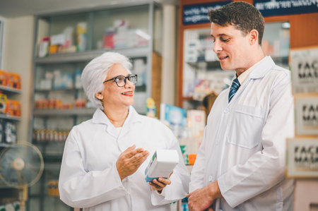 skilled pharmacist is consulting, analyzing the use of drugs to recommend and supervise patients according to prescriptions in modern pharmacies.の写真素材