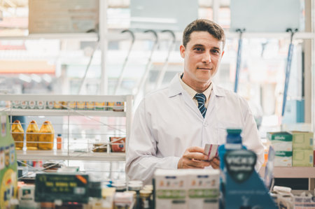 Pharmacist checking Checks Inventory of Medicine, Drugs, Vitamins and prescription medication checks in modern pharmacy.の写真素材