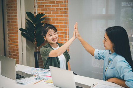 Business colleagues making a fist bumpp are happy to work together successfully , Working in a reliable teamの写真素材