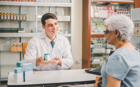 Pharmacist giving advice And advice for patients who come to buy Medicine, Drugs, Vitamins products, according to prescriptions in modern pharmacies.の写真素材
