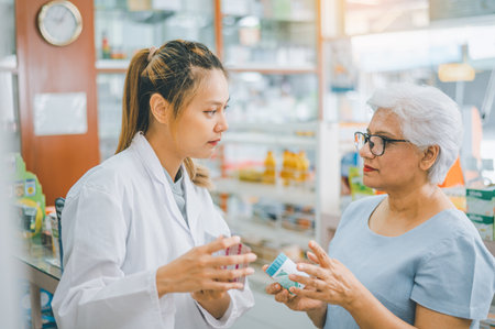 Pharmacist giving advice And advice for patients who come to buy Medicine, Drugs, Vitamins products, according to prescriptions in modern pharmacies.の写真素材
