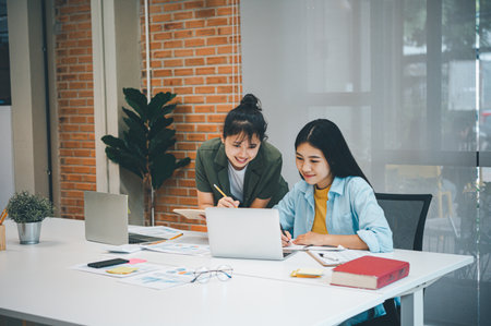 group of business people working and communicating together in the office With the charging of graphs for analysis, conceptual analysis and business planningの写真素材
