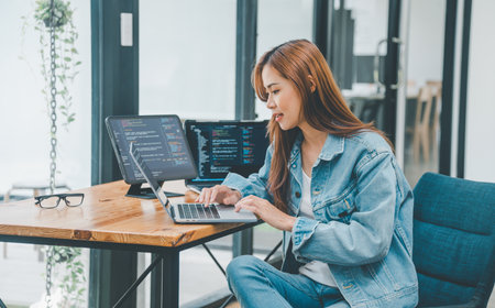 Female programmer working on coding, software development and web design.Concept technology development.の写真素材