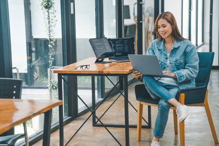 Female programmer working on coding, software development and web design.Concept technology development.の写真素材