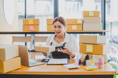 Small business owners online are offering their customers their orders and products via video call. and check the orders that the customers have ordered of online retailers - online shoppingの写真素材