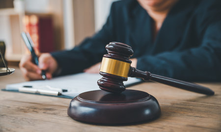 Law theme, mallet of the judge, law enforcement officers, evidence-based cases and documents taken into account.の写真素材