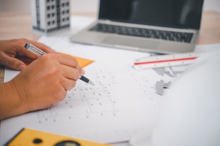 engineer working in office with blueprints, inspection in workplace for architectural plan, construction project ,Business constructionの写真素材