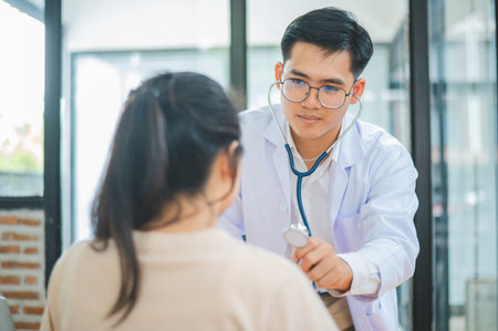 Doctors are inquiring about the patient's symptoms, notifying the results of the physical examination, and recommending treatment and health care.の写真素材