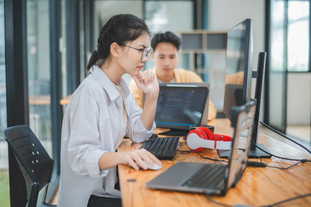 team programmer focuses on software development, site design, and the advancement of coding and programming technology.concepts for technological developmentの写真素材